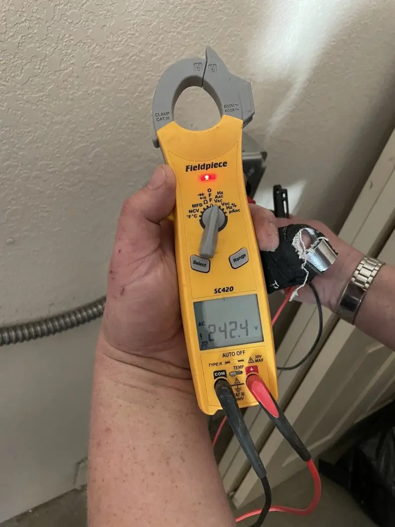 Voltage testing with clamp meter during Outlet Installation in Sugarcreek